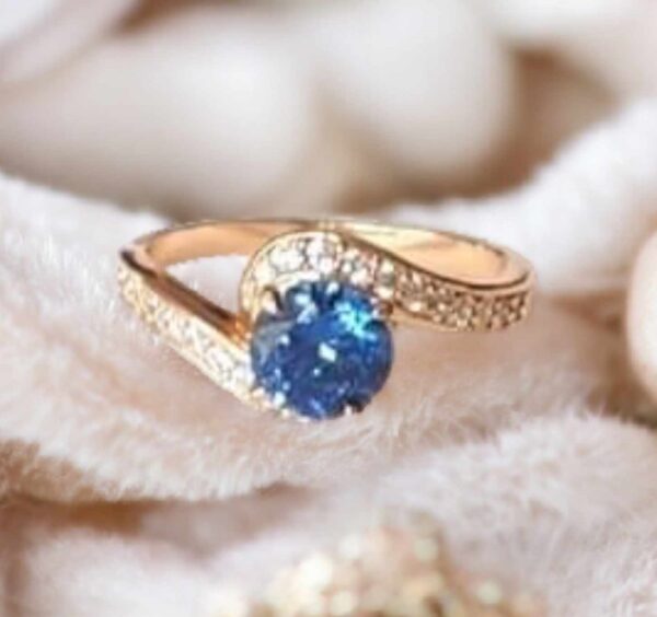 LJCR18  Blue Centred Love Ring. Size 8 1/2